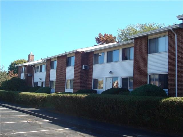 80 County Street, Unit 2G Norwalk, CT 06851 - Photo 1 of 1 a front view of a house with a garden