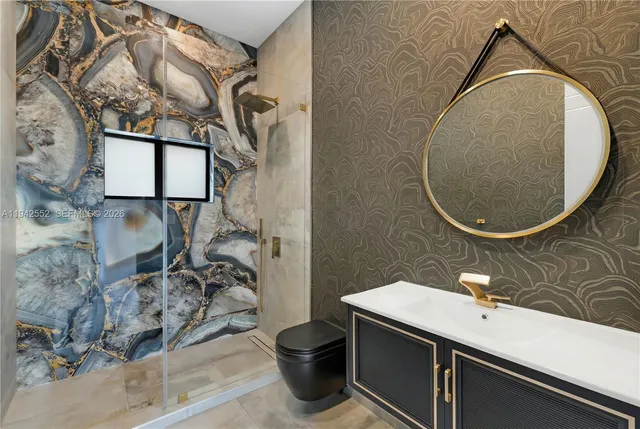 an aerial view of a houses with a yard