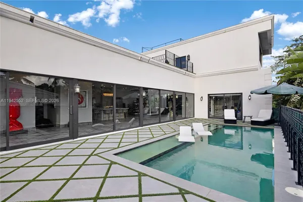 a lobby with furniture and window