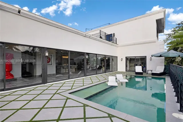 a view of a table and chairs in the garden
