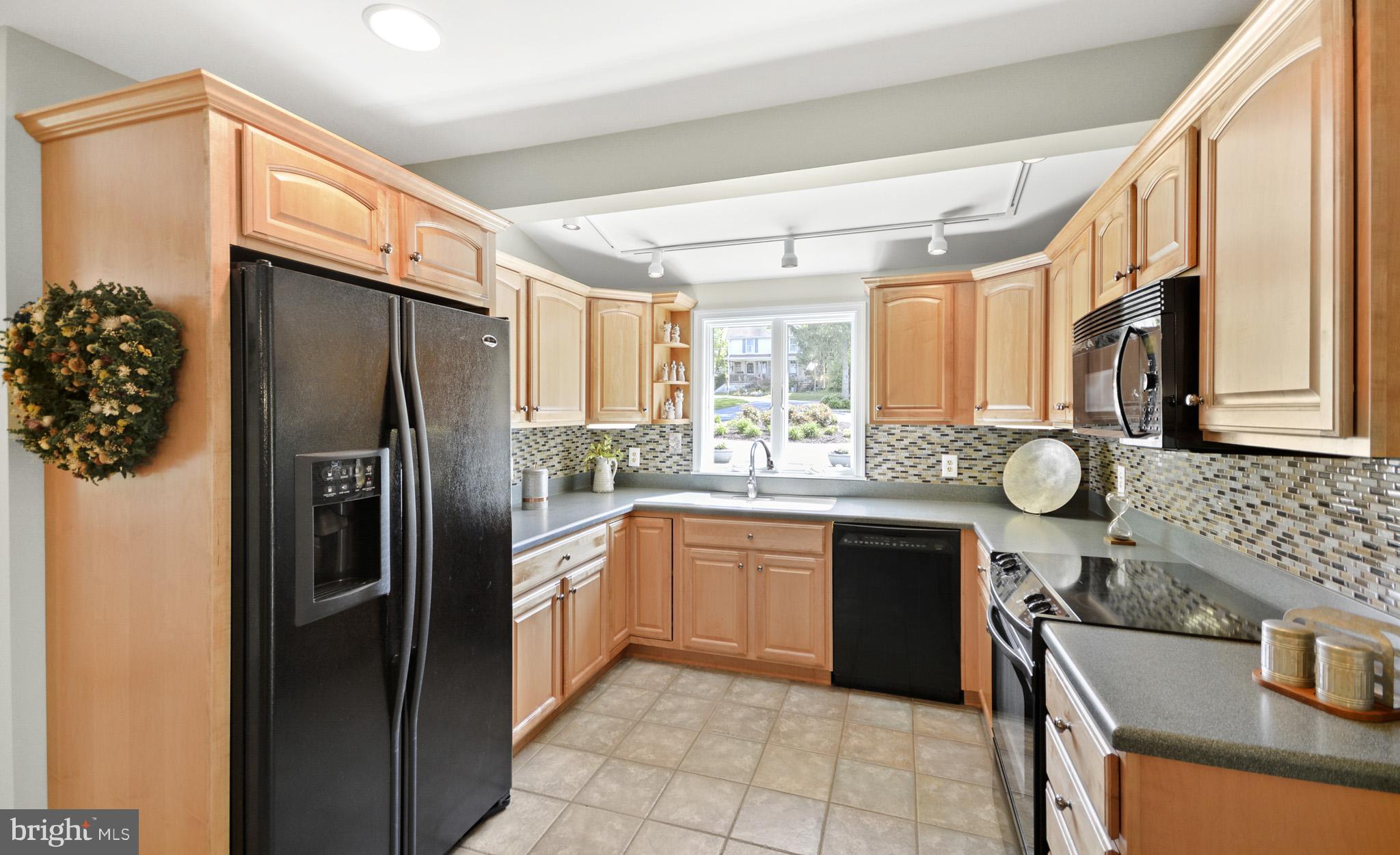 Kitchen has tile floors, Corina counter tops