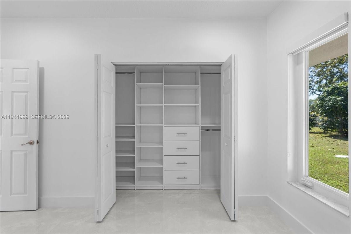 24555 Southwest 167th Avenue, Unit 1 Homestead, FL 33031 - Photo 15 of 33 a view of closet area with window