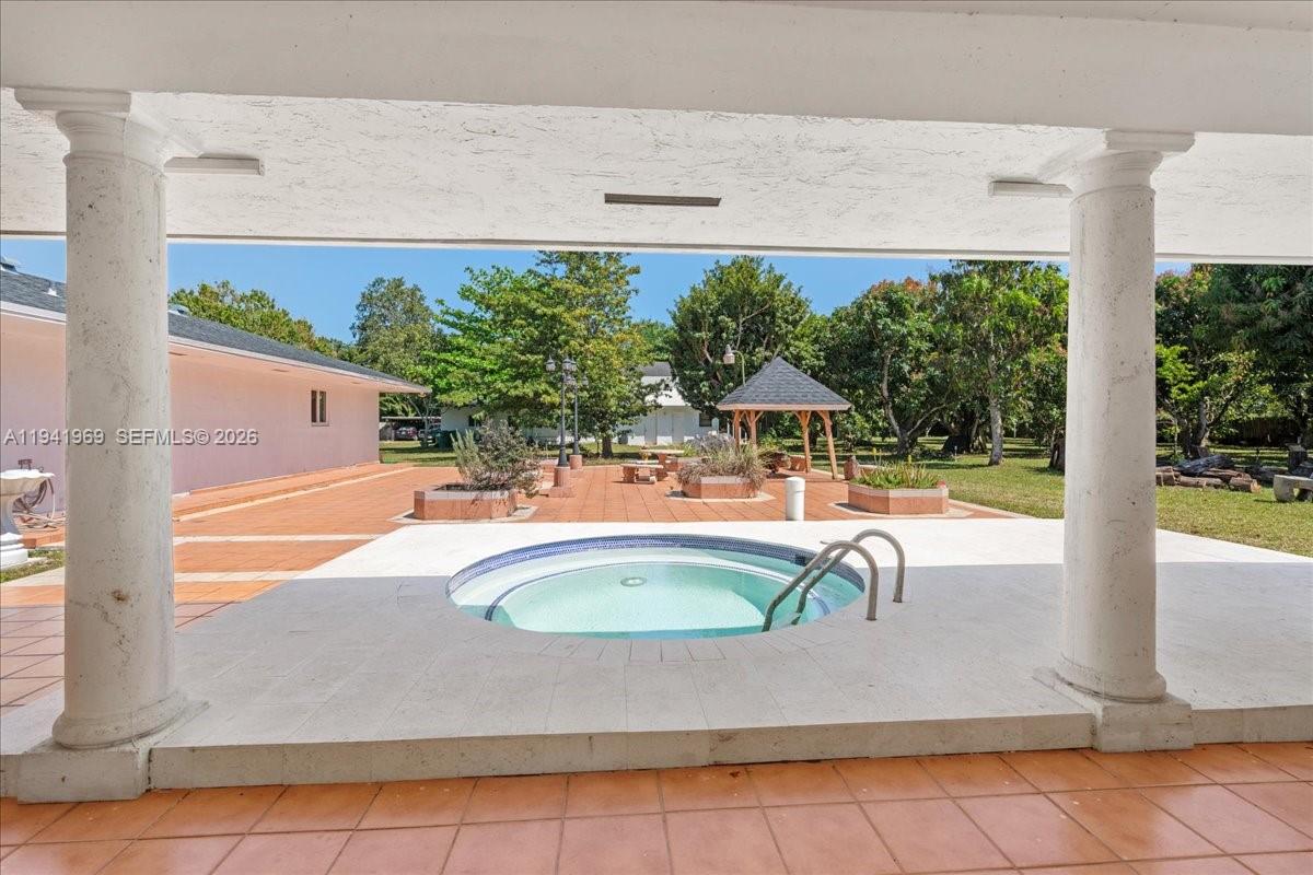 24555 Southwest 167th Avenue, Unit 1 Homestead, FL 33031 - Photo 21 of 33 a bathroom with a bathtub