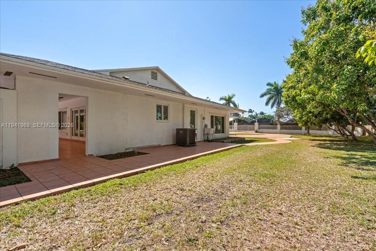 24555 Southwest 167th Avenue, Unit 1 Homestead, FL 33031 - Photo 25 of 33 a house view with swimming pool in front of it
