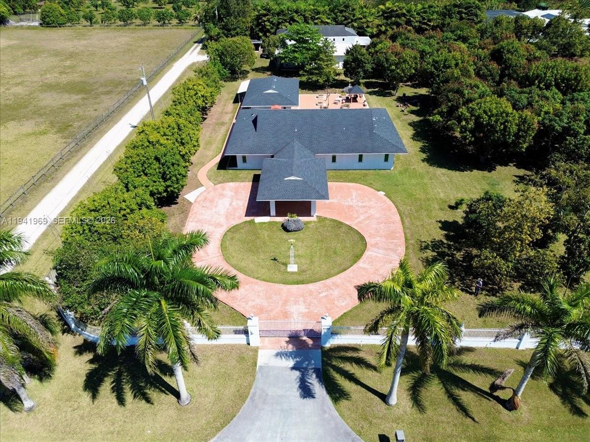 24555 Southwest 167th Avenue, Unit 1 Homestead, FL 33031 - Photo 27 of 33 an aerial view of a house with swimming pool and outdoor seating
