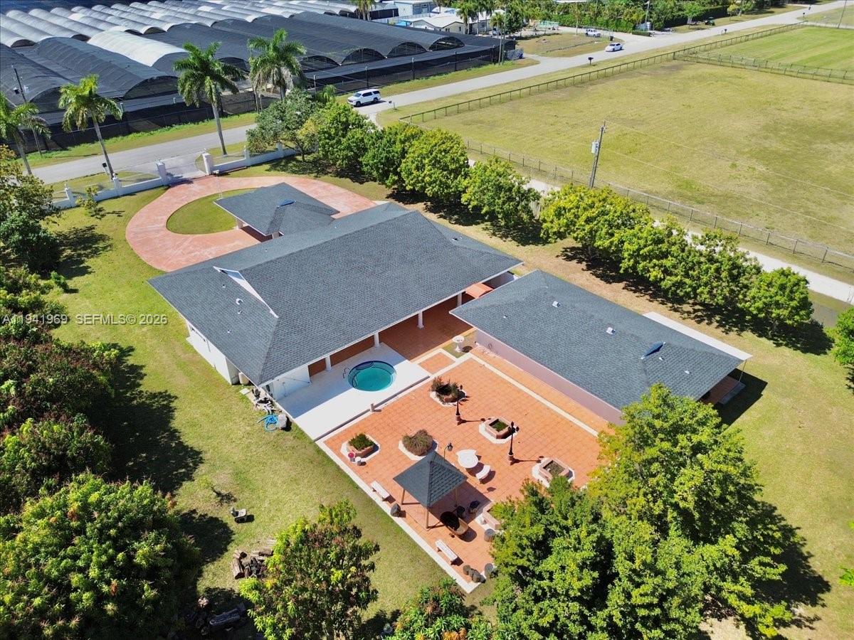24555 Southwest 167th Avenue, Unit 1 Homestead, FL 33031 - Photo 7 of 33 an aerial view of a house with a swimming pool