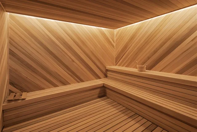 a living room with furniture a rug and a floor to ceiling window