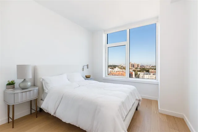 a bedroom with a bed and a table in it