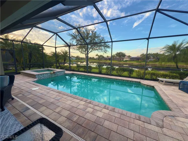 a view of a swimming pool with a patio