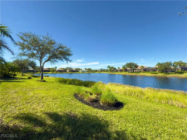 a view of a lake with a big yard