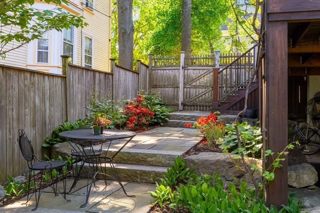 99 Upland Road Cambridge, MA 02140 - Photo 13 of 16 a view of a backyard with chair and potted plants