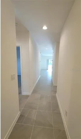 a view of hallway with natural light