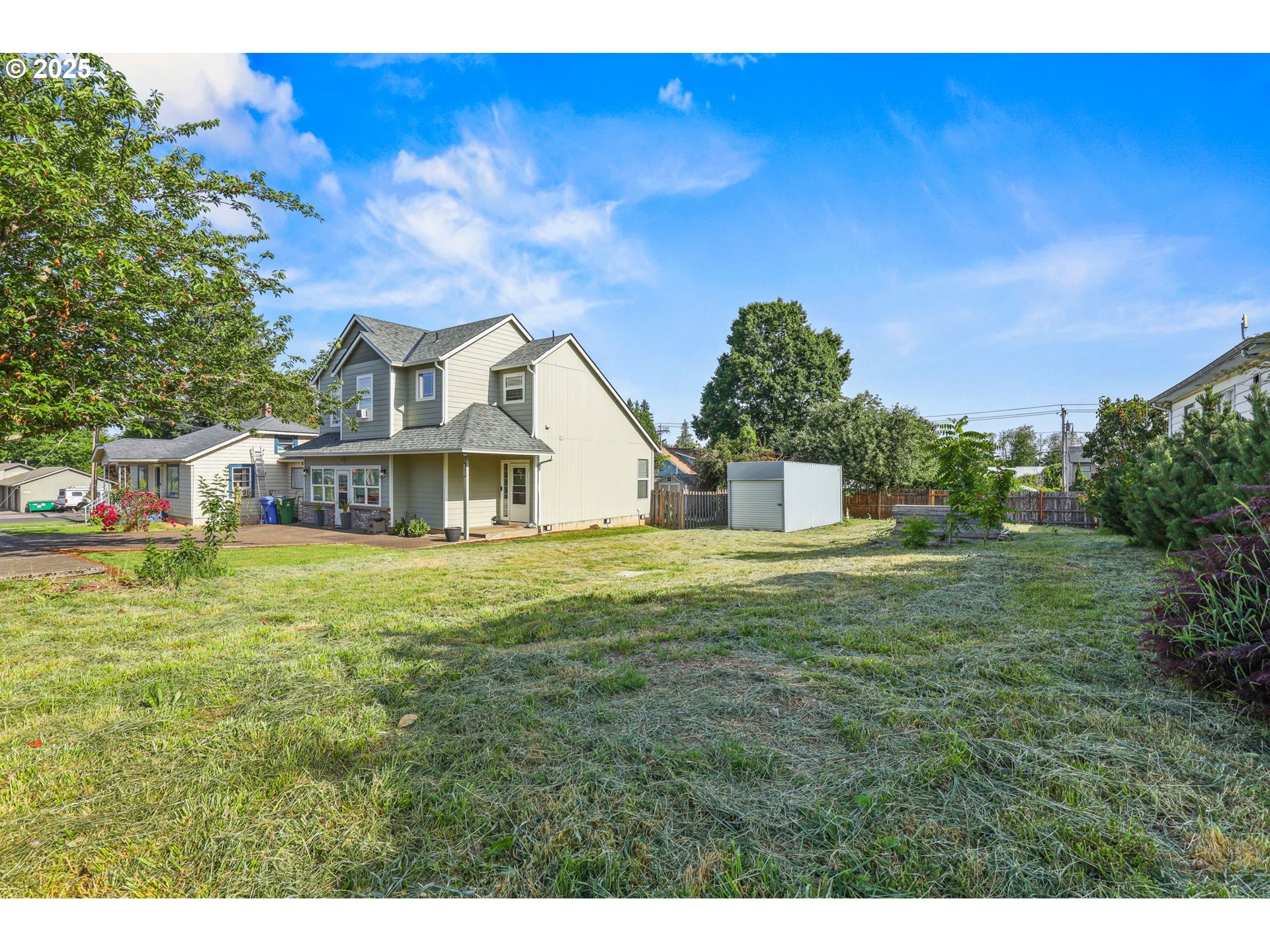 38565 Pleasant Street Sandy, OR 97055 - Photo 8 of 13 a front view of a house with a garden