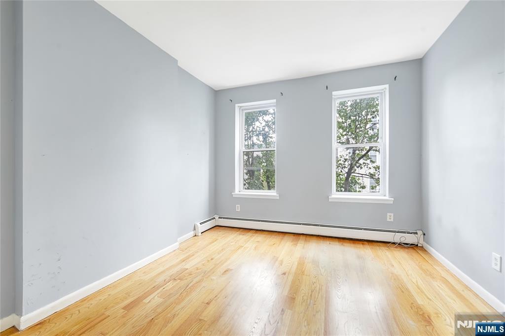 523 Adams Street, Unit 3 Hoboken, NJ 07030 - Photo 17 of 19 an empty room with a window
