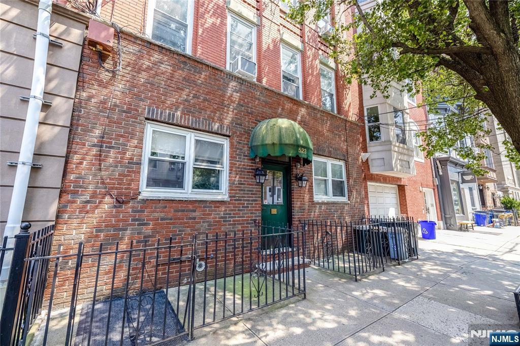 523 Adams Street, Unit 3 Hoboken, NJ 07030 - Photo 3 of 19 a brick building with a large windows