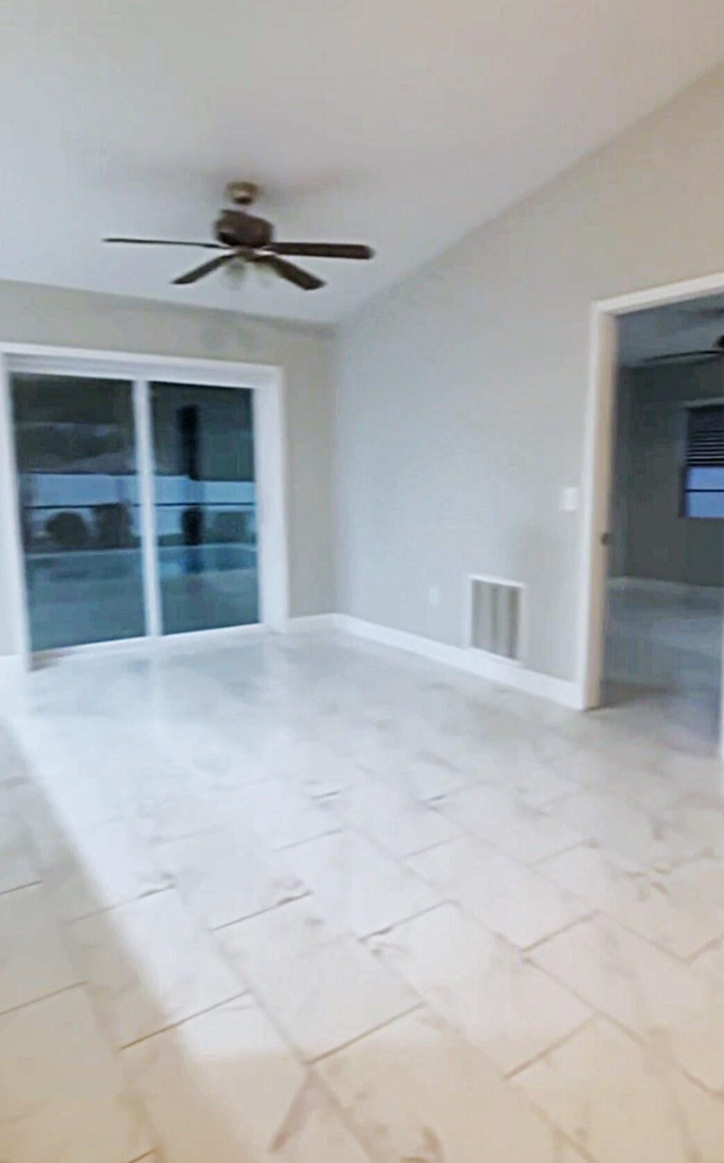 4372 Lamson Avenue Spring Hill, FL 34608 - Photo 2 of 8 a view of empty room with a ceiling fan