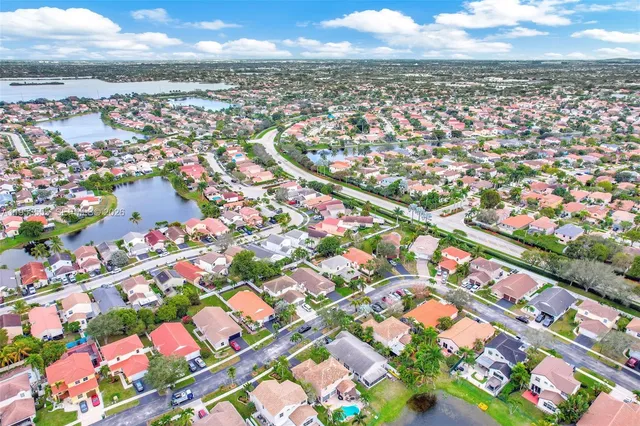 a living room with furniture ceiling fan and a window