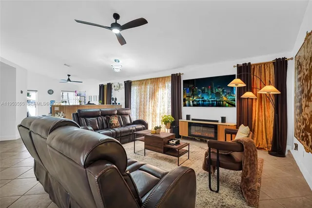a kitchen with granite countertop a stove sink and cabinets