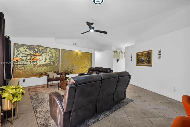a living room with furniture rug and window