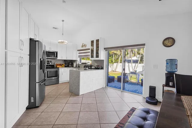 a bathroom with a granite countertop sink a shower and a mirror