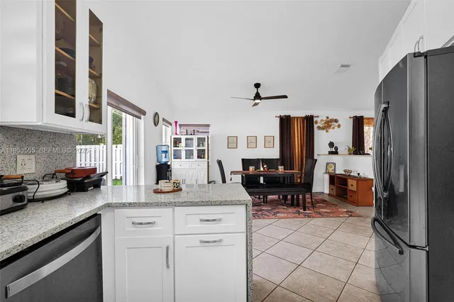 a bathroom with a sink vanity mirror and toilet