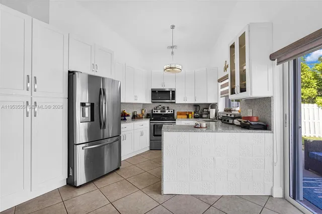 a view of a livingroom with furniture and a rug