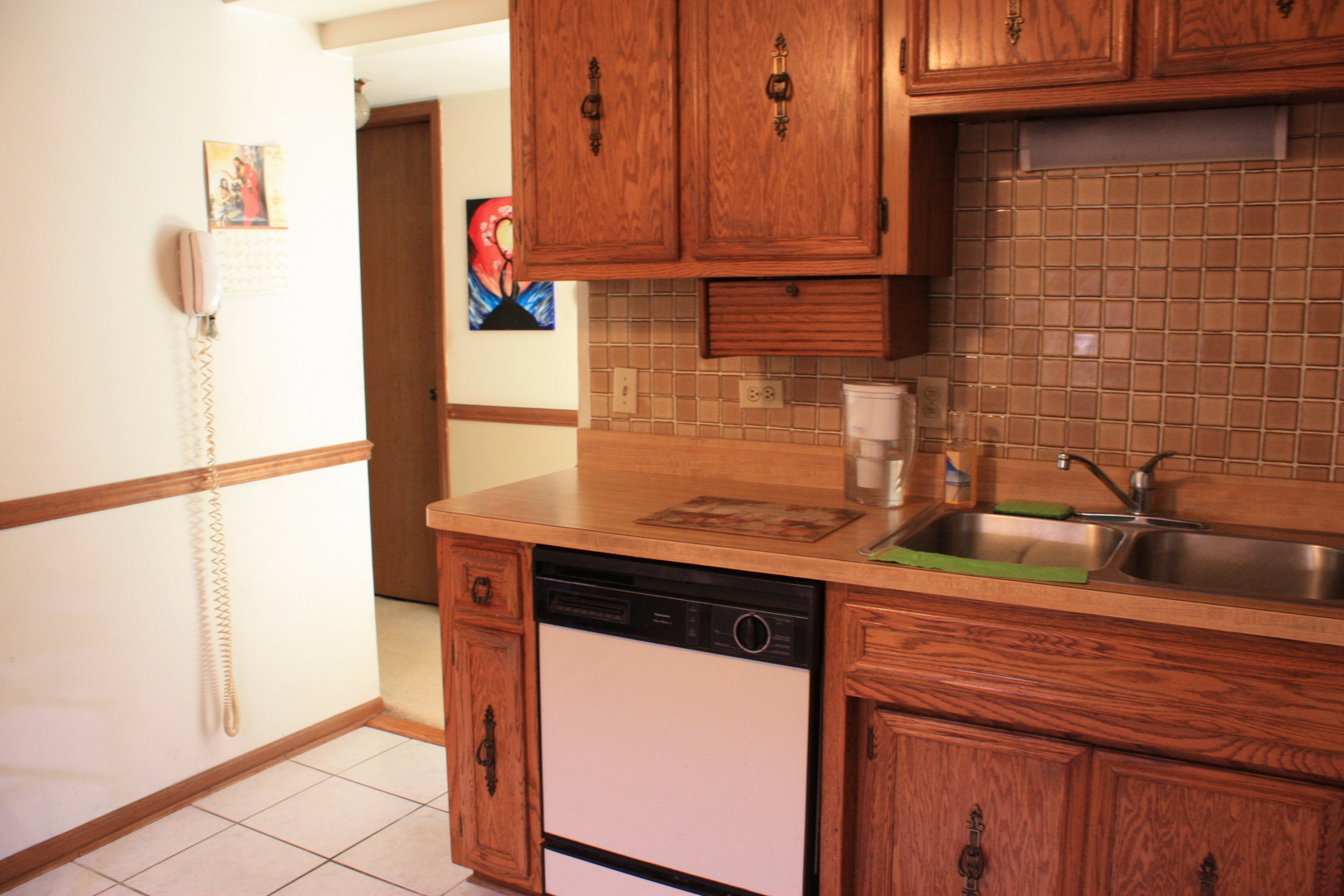 10900 Central Avenue, Unit 2C Chicago Ridge, IL 60415 - Photo 11 of 16 a kitchen with a sink and a refrigerator