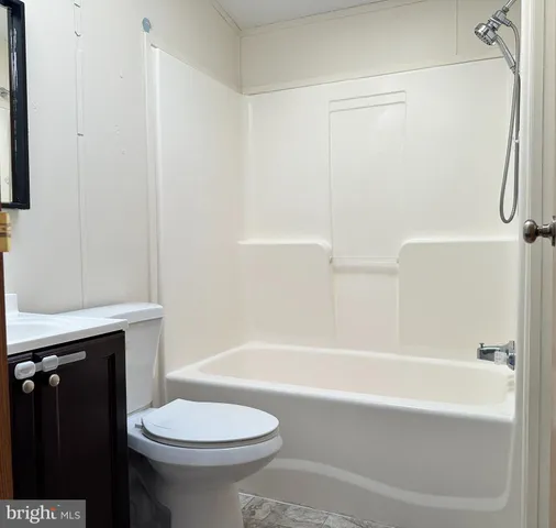 a bathroom with a sink a toilet and bathtub