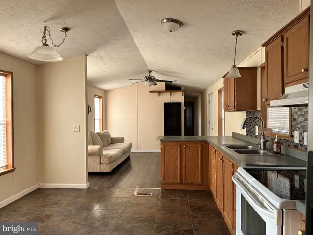 a kitchen that has a sink and cabinets