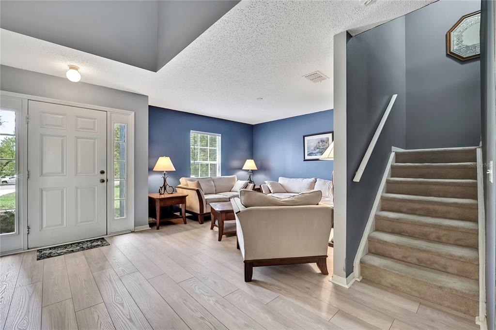 11257 Persimmon Avenue Weeki Wachee, FL 34614 - Photo 12 of 50 a living room with furniture and a wooden floor