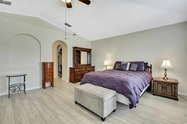 a bed room with a bed and a television