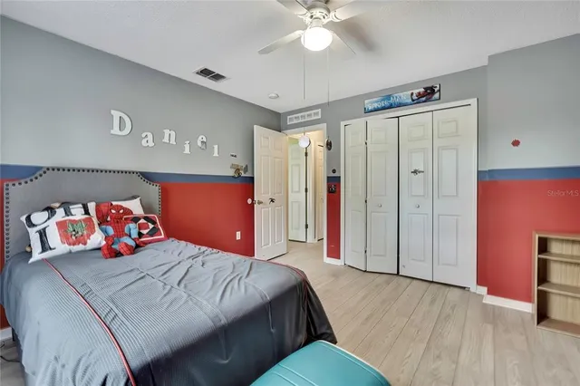 a bedroom with a bed and window