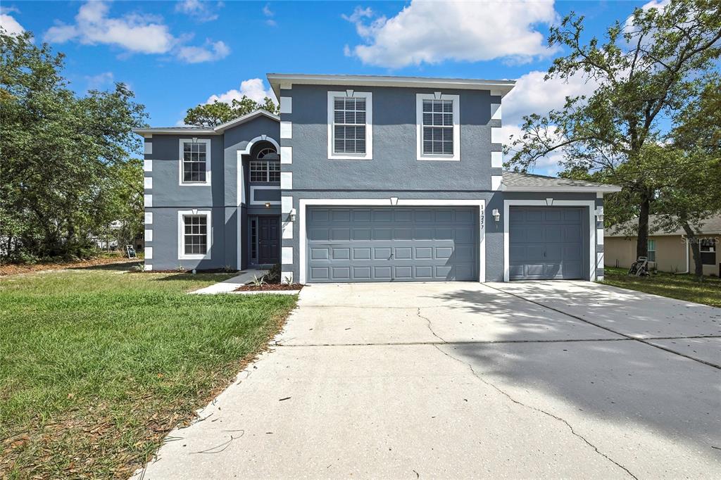 11257 Persimmon Avenue Weeki Wachee, FL 34614 - Photo 3 of 50 front view of a house