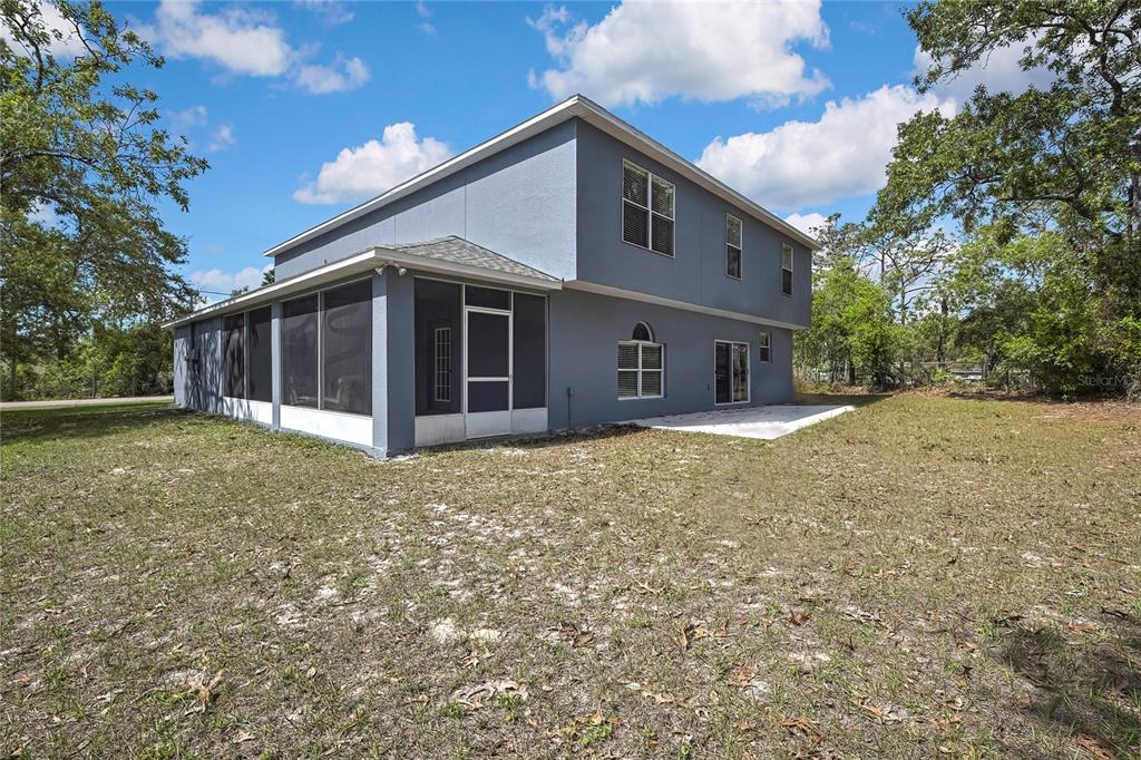 11257 Persimmon Avenue Weeki Wachee, FL 34614 - Photo 31 of 50 a house view with a outdoor space