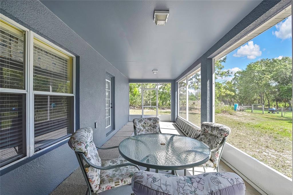 11257 Persimmon Avenue Weeki Wachee, FL 34614 - Photo 34 of 50 a dining room with furniture window and outside view