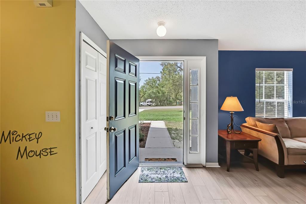 11257 Persimmon Avenue Weeki Wachee, FL 34614 - Photo 5 of 50 a view of a room with furniture and wooden floor