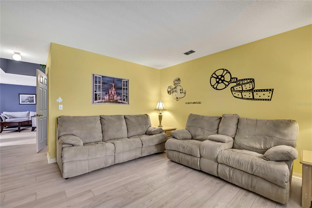 11257 Persimmon Avenue Weeki Wachee, FL 34614 - Photo 7 of 50 a living room with couch and a couch