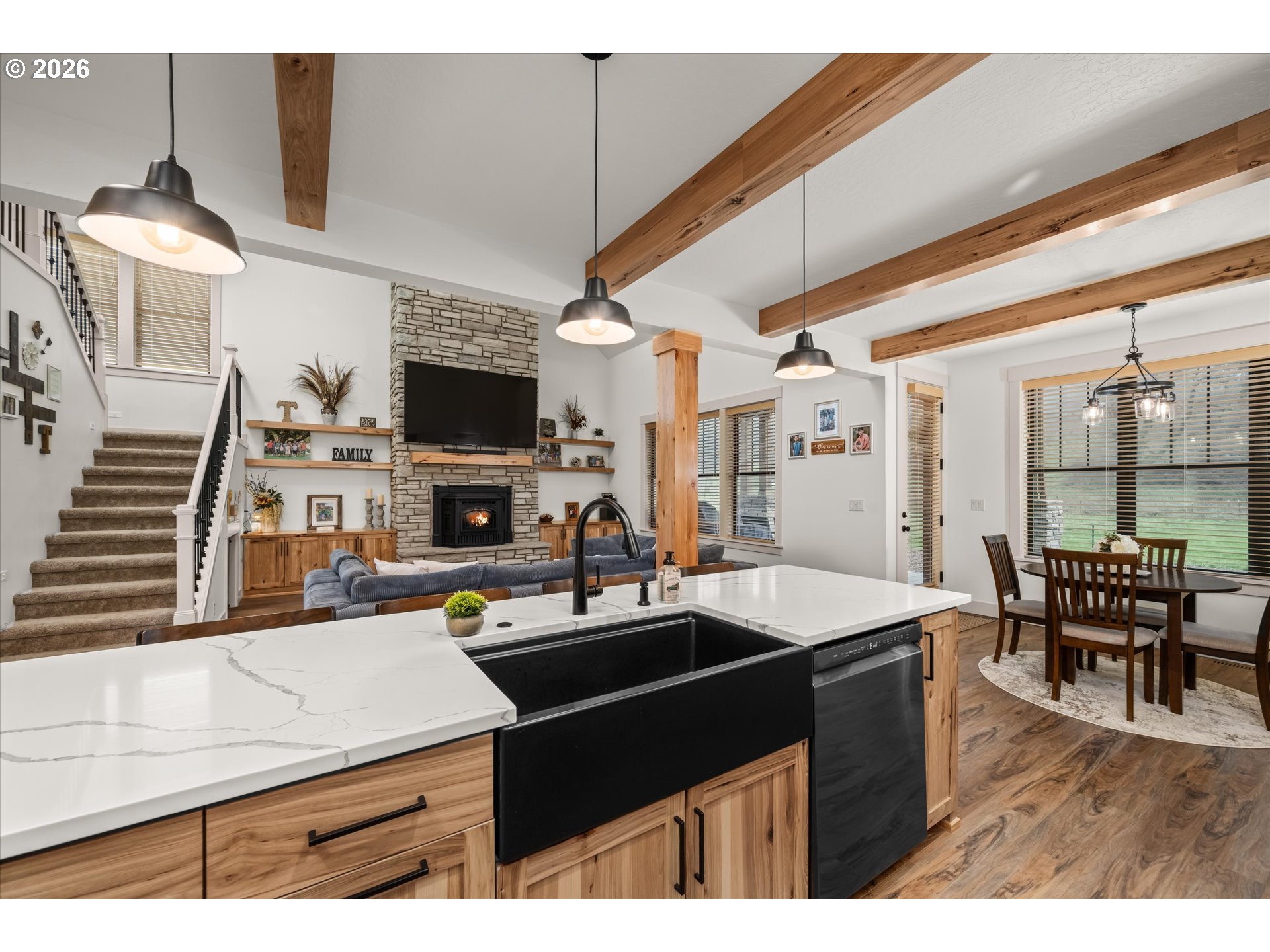 37640 Upper Camp Creek Road Springfield, OR 97478 - Photo 13 of 47 a kitchen with a sink a stove and chairs