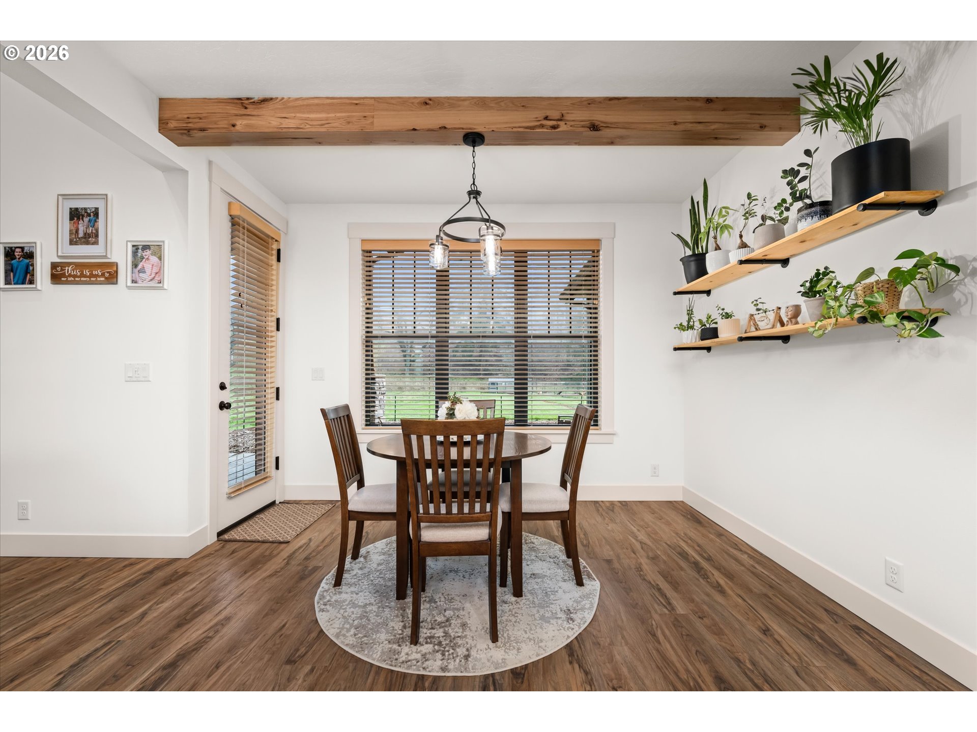 37640 Upper Camp Creek Road Springfield, OR 97478 - Photo 14 of 47 a dining room with furniture potted plants and wooden floor