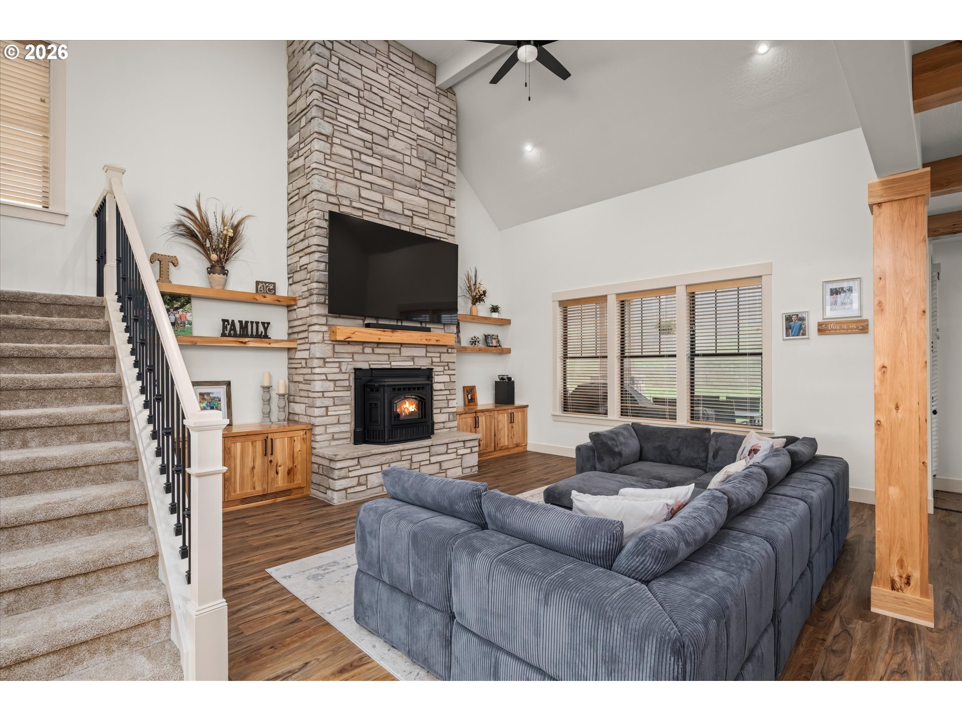 37640 Upper Camp Creek Road Springfield, OR 97478 - Photo 15 of 47 a living room with furniture a flat screen tv and a fireplace
