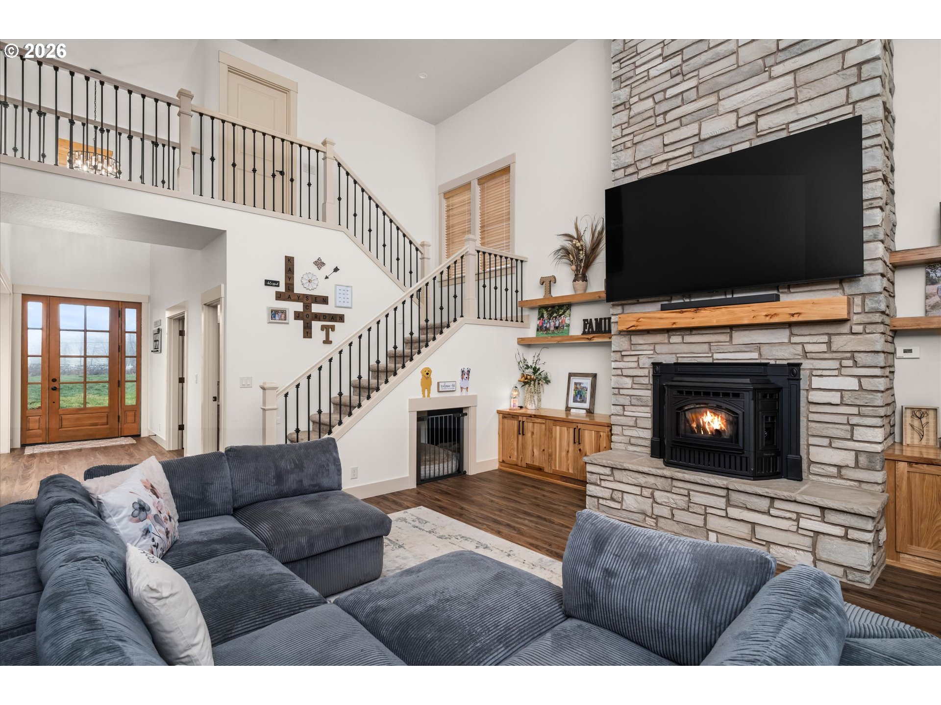 37640 Upper Camp Creek Road Springfield, OR 97478 - Photo 17 of 47 a living room with furniture a flat screen tv and a fireplace