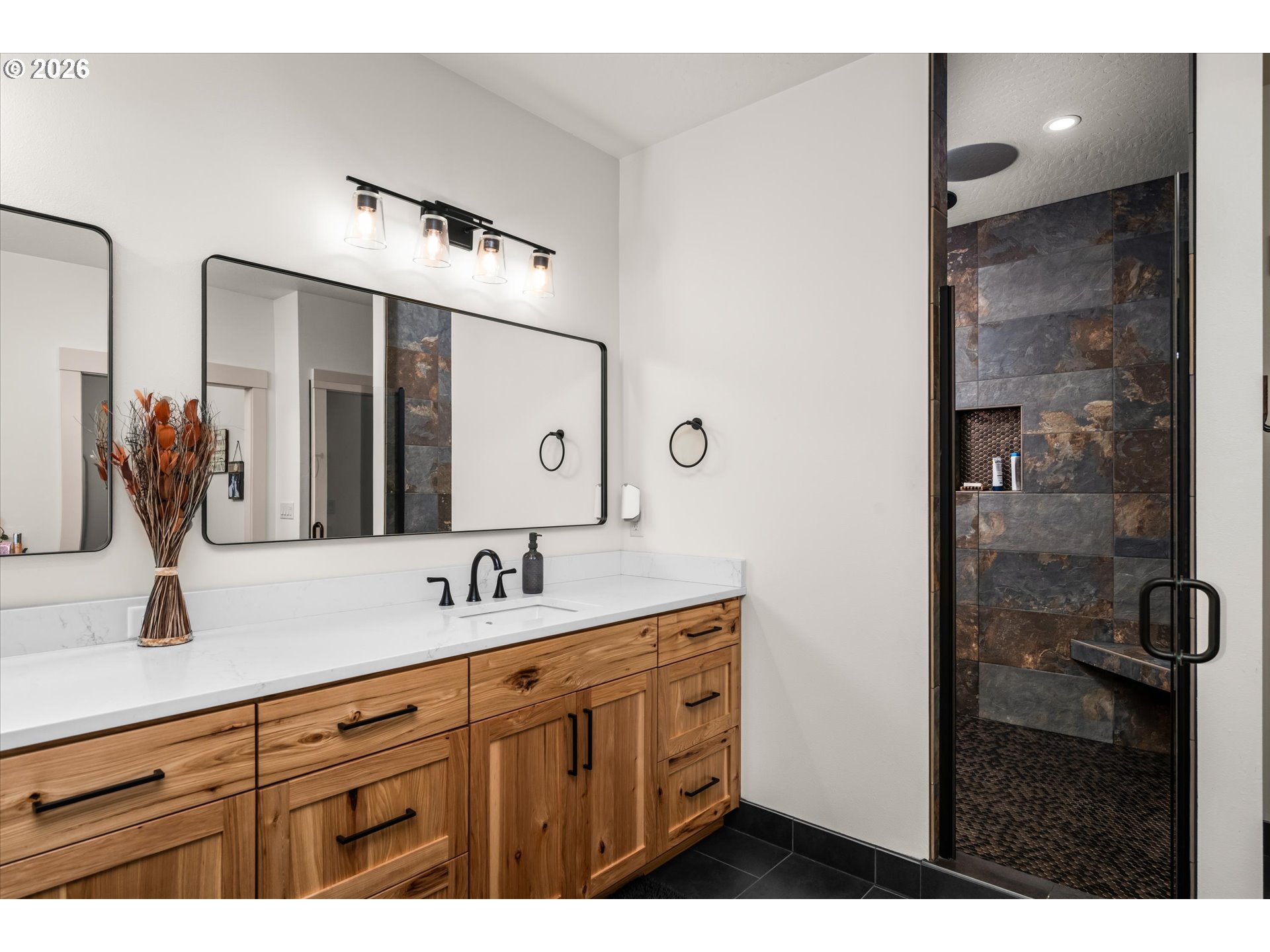 37640 Upper Camp Creek Road Springfield, OR 97478 - Photo 26 of 47 a bathroom with double vanity sink a mirror and shower