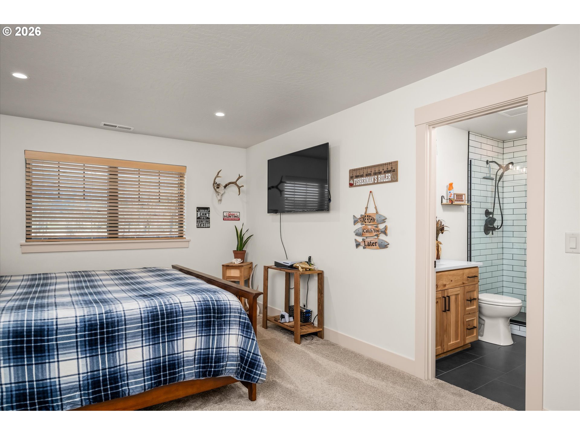 37640 Upper Camp Creek Road Springfield, OR 97478 - Photo 31 of 47 a bedroom with a bed window and a flat screen tv