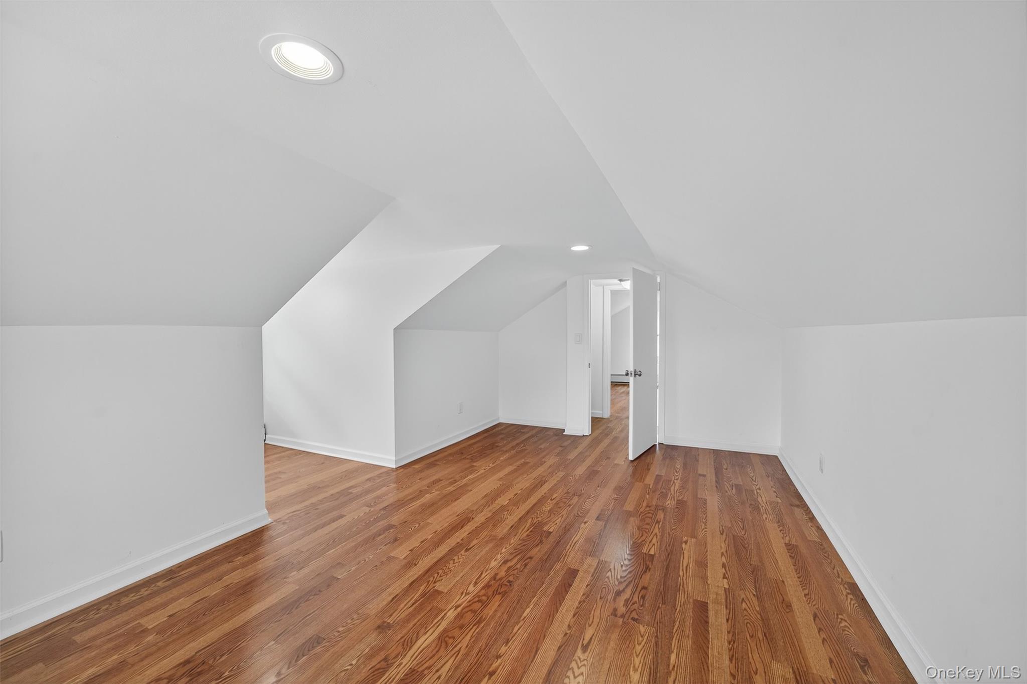 85 Holloran Road New Windsor, NY 12553 - Photo 18 of 22 a view of an empty room with wooden floor