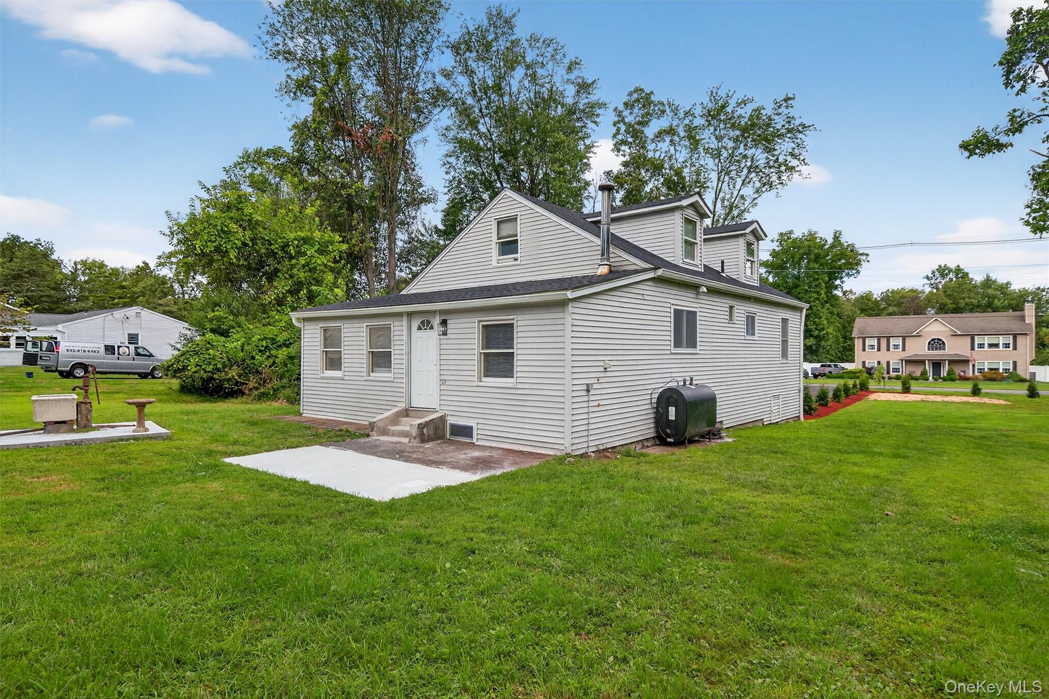 85 Holloran Road New Windsor, NY 12553 - Photo 19 of 22 a front view of house with yard and trees