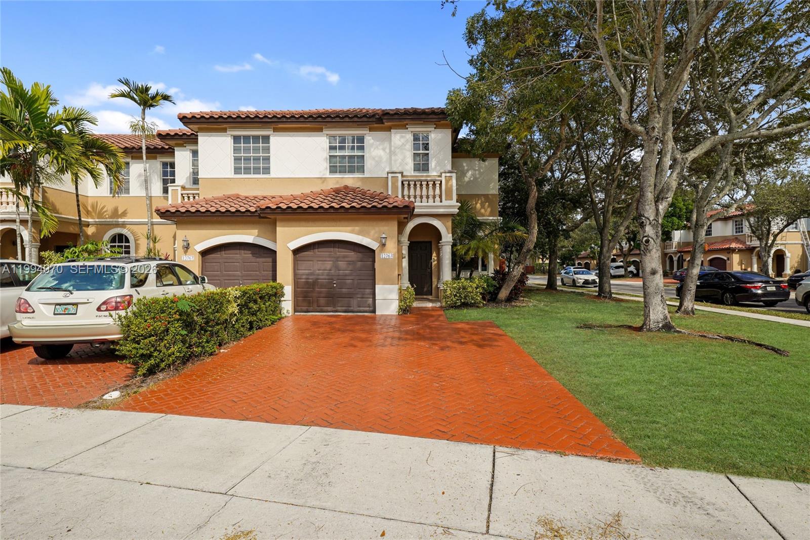12763 Southwest 50th Street Miramar, FL 33027 - Photo 1 of 38 a front view of a house with garden
