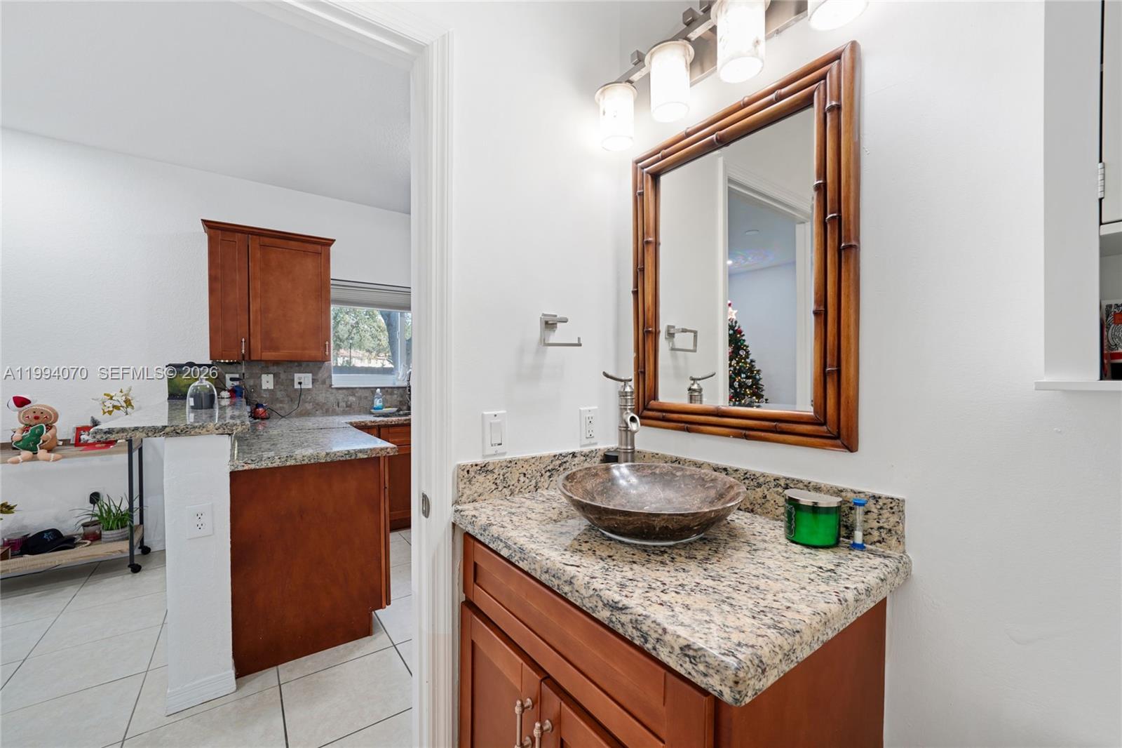 12763 Southwest 50th Street Miramar, FL 33027 - Photo 11 of 38 a bathroom with sink and mirror
