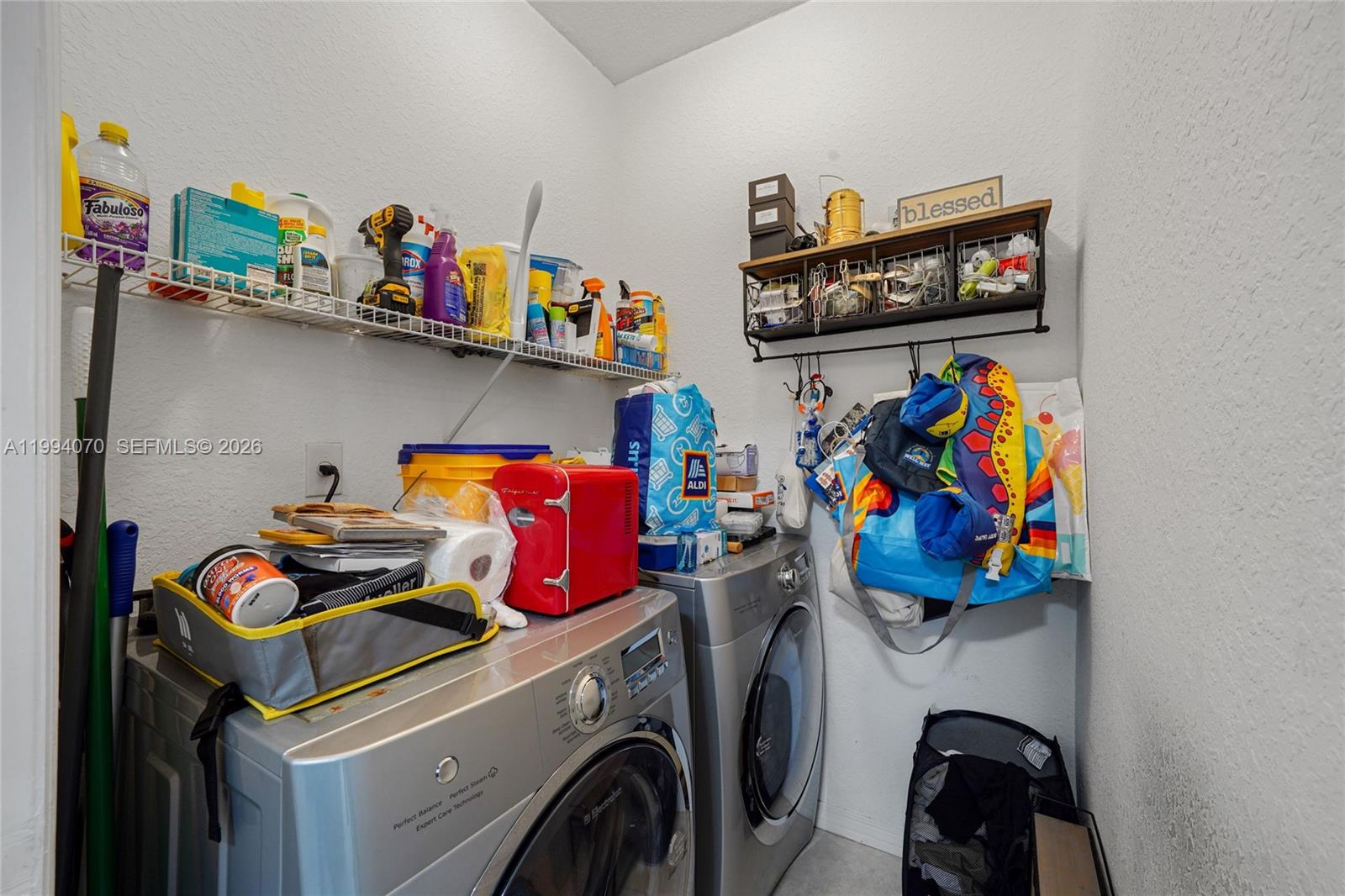 12763 Southwest 50th Street Miramar, FL 33027 - Photo 12 of 38 a utility room with dryer and washer