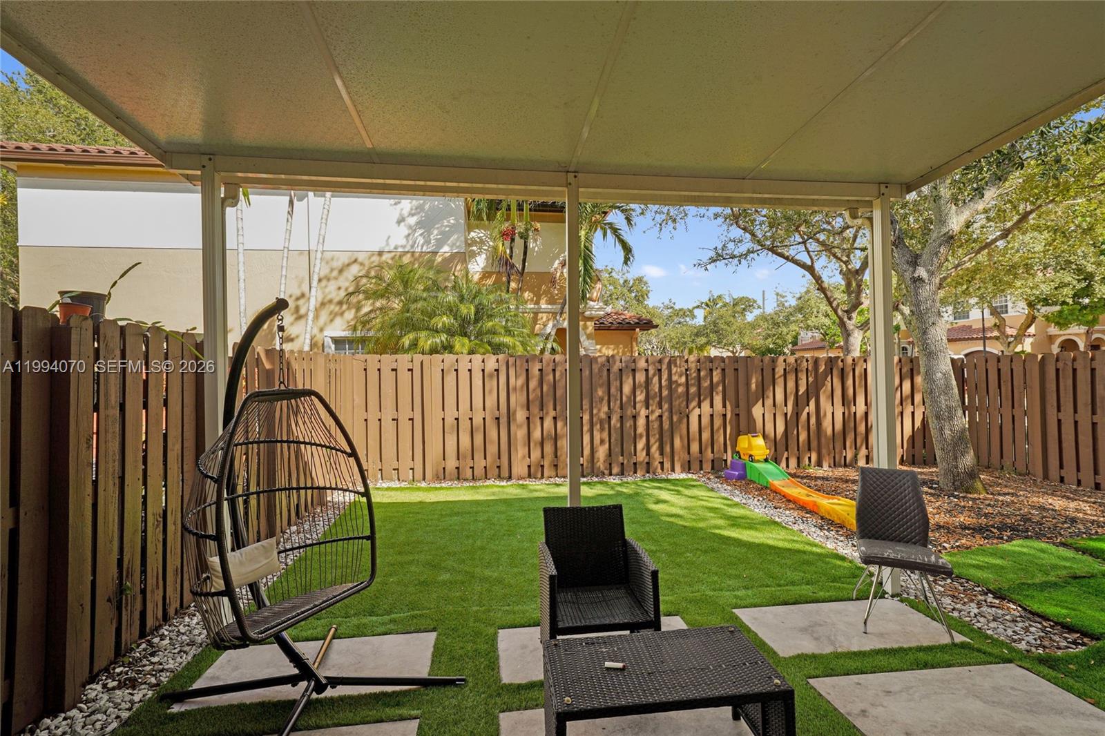 12763 Southwest 50th Street Miramar, FL 33027 - Photo 13 of 38 a view of a room with wooden floor and wooden fence