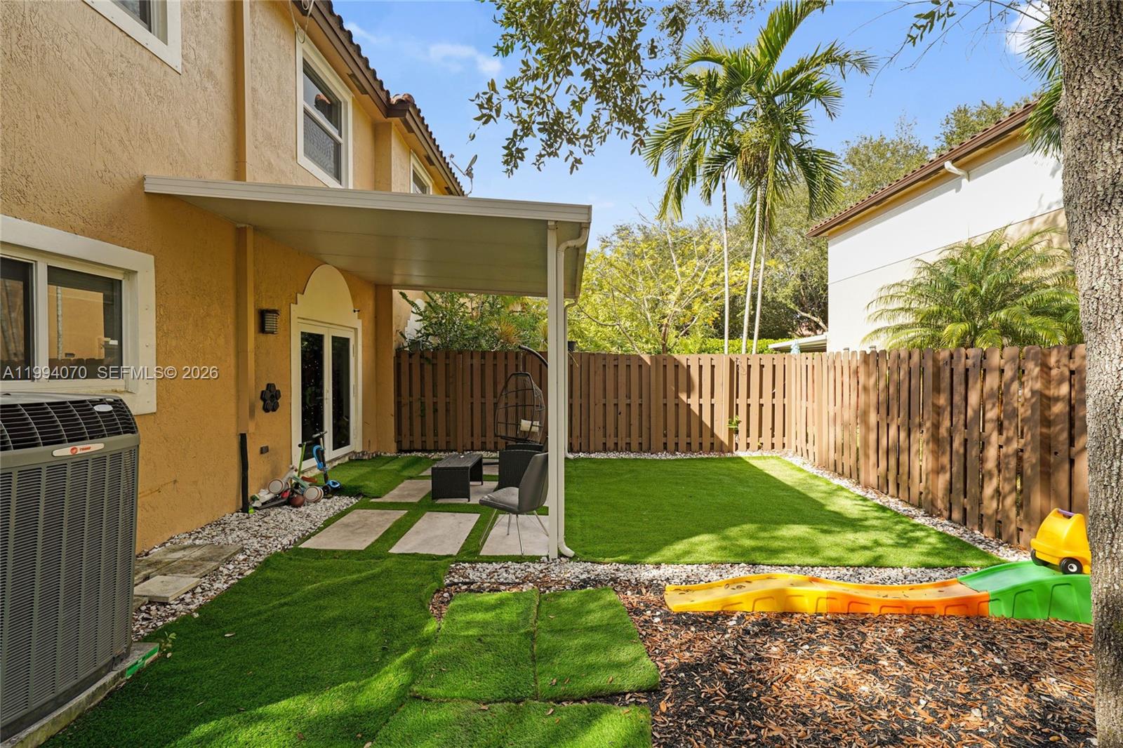 12763 Southwest 50th Street Miramar, FL 33027 - Photo 14 of 38 a view of backyard with a garden and plants